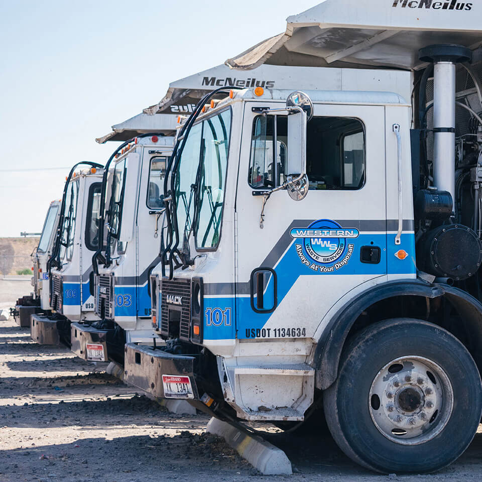 Western Waste Management trucks doing garbage pickup